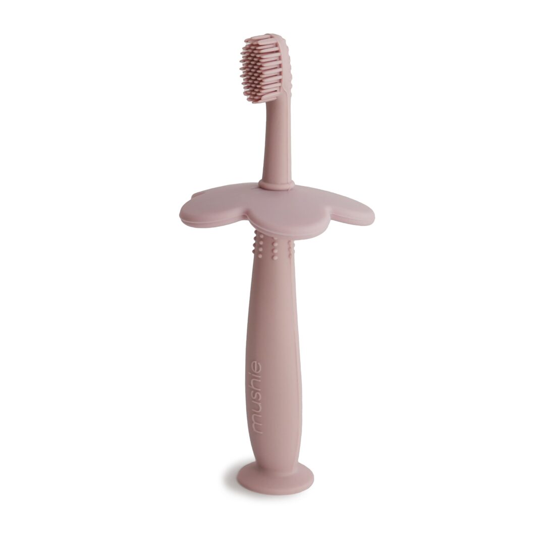 brosse à dents d'apprentissage en silicone mushie blush